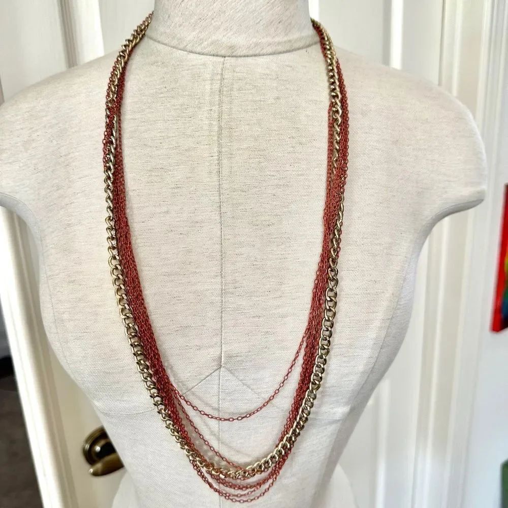 Gold tone orange multi strand chain necklace